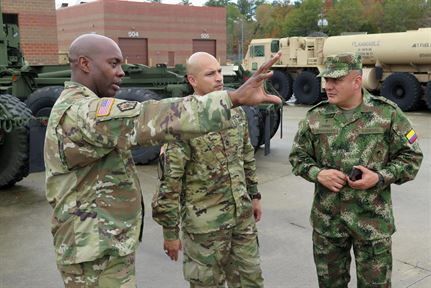 South Carolina National Guardsmen talk with an officer of the Colombian army..