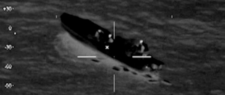 A U.S. Coast Guard HC-144 Ocean Sentry aircraft detects a 25-foot go-fast boat with four individuals and suspicious packages aboard moving at a high rate of speed south of the Dominican Republic Jan. 22 2014.