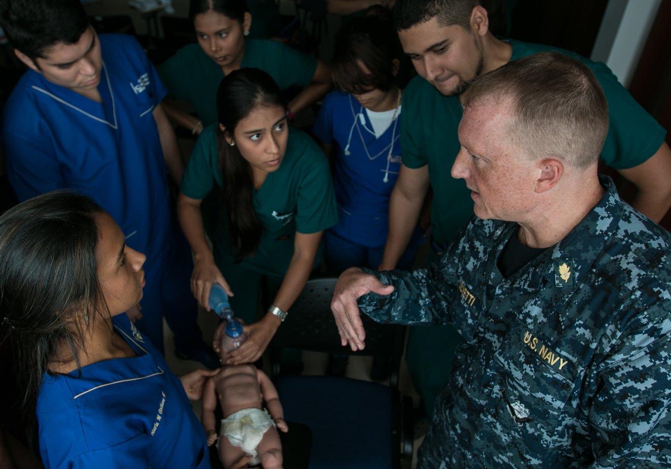 U.S. Navy Cmdr. Tony Silvetti, a gynecologist assigned to Naval Hospital Camp Lejeune, explains the process to safely resuscitate a chocking baby to a group of medical students as a part of subject matter expert exchange with medical staff at Naval Hospital Cartagena during Southern Partnership Station 2016.