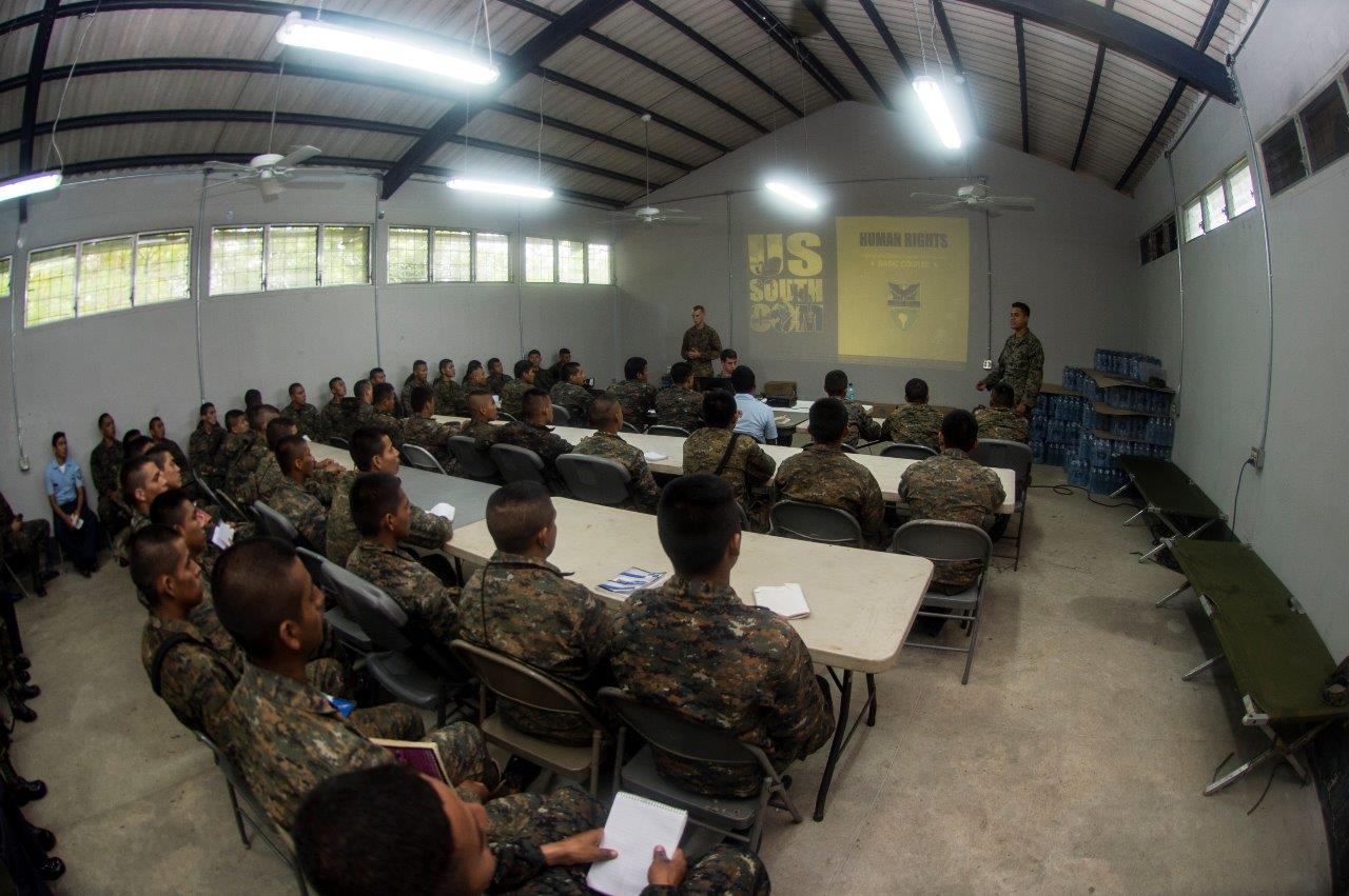 U.S. Marines assigned to a landing attack subsequent operations team lead a discussion with Guatemalan service members about human rights July 28, 2014, in Puerto Barrios, Guatemala, during Southern Partnership Station (SPS) 2014.